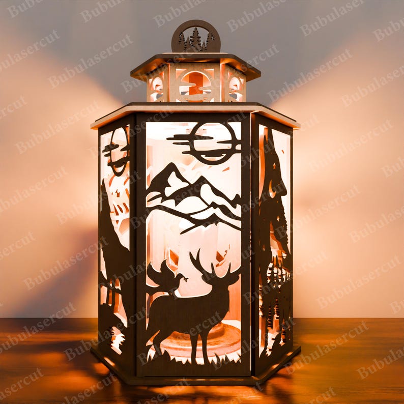 May include: A wooden lantern featuring a mountain scene and a moose silhouette. The lantern has a light inside, illuminating the scene. The lantern is made from laser-cut wood and has a rustic, woodland theme.