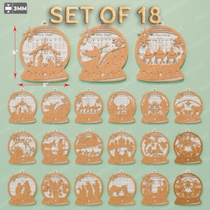 May include: Set of 18 laser-cut wooden Christmas ornaments. Each ornament is a snow globe design, approximately 6 inches tall and 5 inches wide, with a festive scene and song lyrics. The text "SET OF 18" is visible.