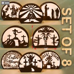 Puede incluir: Un conjunto de ocho lámparas decorativas de madera con temática religiosa. Cada lámpara presenta un diseño de silueta único, que incluye escenas de Jesús, cruces y bendiciones de Pascua. Las lámparas miden aproximadamente 25 cm de ancho y 20 cm de alto.