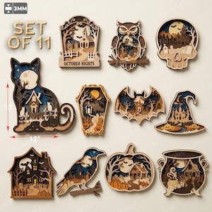 Peut inclure: Un ensemble de 11 décorations d'Halloween en bois superposé, de 3 mm d'épaisseur et 12 pouces de taille. Les motifs incluent un chat, un hibou, un crâne, un cercueil, une chauve-souris, un chapeau de sorcière, une maison, un corbeau, une citrouille.