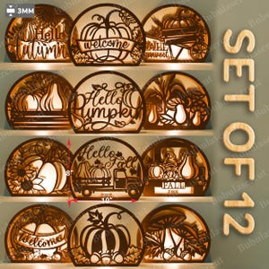 May include: A set of 12 wooden fall-themed decorative light-up signs. Each sign is a semi-circle shape with intricate cut-out designs, including pumpkins, leaves, and text like "Hello Autumn" and "Welcome". The signs are approximately 10 inches wide and 8 inches tall.
