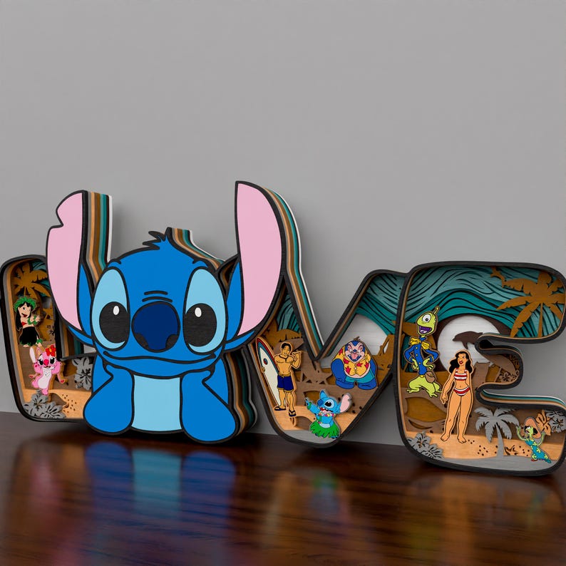 May include: A wooden cutout of the word 'LOVE' with a blue Stitch character from Lilo & Stitch in the first letter. The letters are layered and have a beach scene with palm trees, waves, and other characters from the movie.