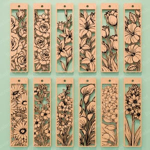 May include: A collection of twelve wooden bookmarks with intricate floral designs. Each bookmark features a different flower, including roses, lilies, and tulips, cut out in a detailed, black outline. The bookmarks are rectangular with a small hole at the top.