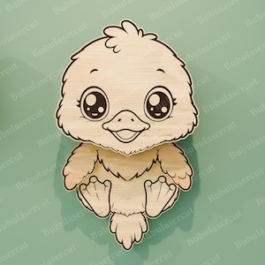 May include: A wooden cutout of a cartoon bird with large, expressive eyes and a smiling beak. The bird is light brown with darker outlines, and its wings and feet are visible. The background is a solid teal color.