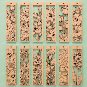 May include: A collection of twelve wooden bookmarks with intricate floral designs. Each bookmark features a different flower, including roses, lilies, and tulips, cut out in a detailed, black outline. The bookmarks are rectangular with a small hole at the top.