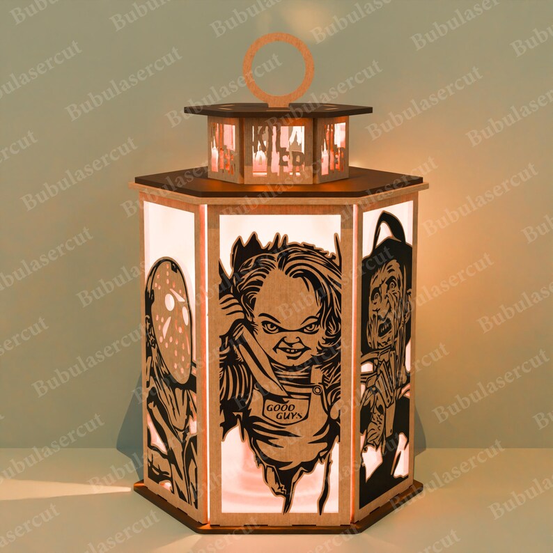 May include: A wooden, hexagonal lantern with a handle, featuring cut-out images of horror movie characters. The lantern has a light inside, illuminating the characters. The top of the lantern reads "KILLER".