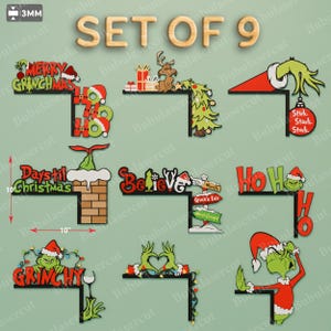 Puede incluir: Un conjunto de nueve decoraciones de esquina con temática navideña. Cada pieza presenta un diseño inspirado en el Grinch con textos festivos como "Merry Grinchmas" y "Believe". El conjunto incluye una chimenea, un árbol de Navidad y una mano sosteniendo un adorno. Las dimensiones son 25.4 cm.