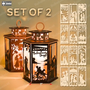 May include: Set of two wooden lanterns with intricate cut-out designs. One lantern features a silhouette of a couple under a tree, the other says "Happy Valentine's Day". The lanterns are 7 inches wide and 11 inches tall.