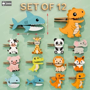 May include: A set of 12 wooden clothespins featuring colorful animal cutouts including a shark, dinosaur, cow, giraffe, panda, elephant, pig, crocodile, lion, fox, whale, and dragon. Each piece is 3mm thick and measures 2 inches in height and width.