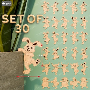Peut inclure: Un ensemble de 30 décorations de Pâques en bois découpées au laser. L'ensemble comprend divers lapins, mesurant environ 10 cm de large et 14 cm de haut. Le texte "SET OF 30" est visible. Le bois est de couleur marron clair.