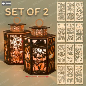 May include: A set of three ceramic mugs with a speckled, cream-colored glaze. Each mug features a different hand-painted design: a blue and green leaf, a yellow flower, and a red berry. The mugs have a simple, rounded shape.