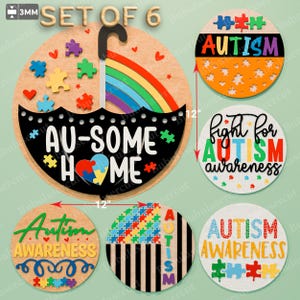 May include: A set of six wooden Autism Awareness signs. The signs include puzzle pieces, rainbows, and the phrases "AU-SOME HOME" and "Autism Awareness." The largest sign is 12 inches in diameter.