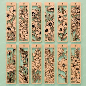 May include: A collection of twelve wooden bookmarks with intricate floral designs. Each bookmark features a different flower, laser-cut with detailed lines and shapes. The bookmarks have a rectangular shape with a small hole at the top for a tassel or string.