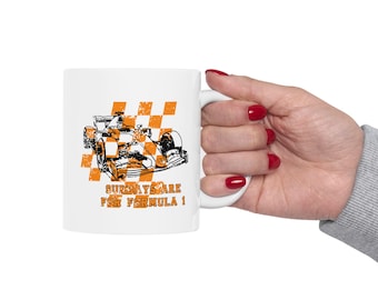 May include: White ceramic mug with a black and orange graphic of a race car and checkered flag. The text "Sundays are for Formula 1" is printed on the mug.