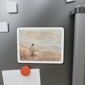 May include: A magnet with a painting of a shepherd leading a flock of sheep across a field. The magnet has the text "Trust in the Lord with all your heart, and do not lean on your own understanding; in all your ways acknowledge Him, and He will make straight your paths Proverbs 3:5-6".
