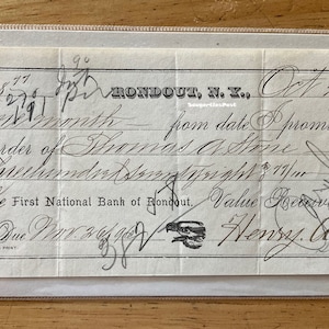May include: A black and white handwritten promissory note dated October 26, 1876, for the amount of $127.77, payable to Thomas A. Stone at the First National Bank of Rondout. The note is signed by Henry C. Stone.