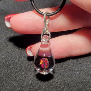 Hand blown glass and black Gilson opal pendant in sterling silver.  I call this teardrop dangle necklace design “Mermaid’s tears”.
