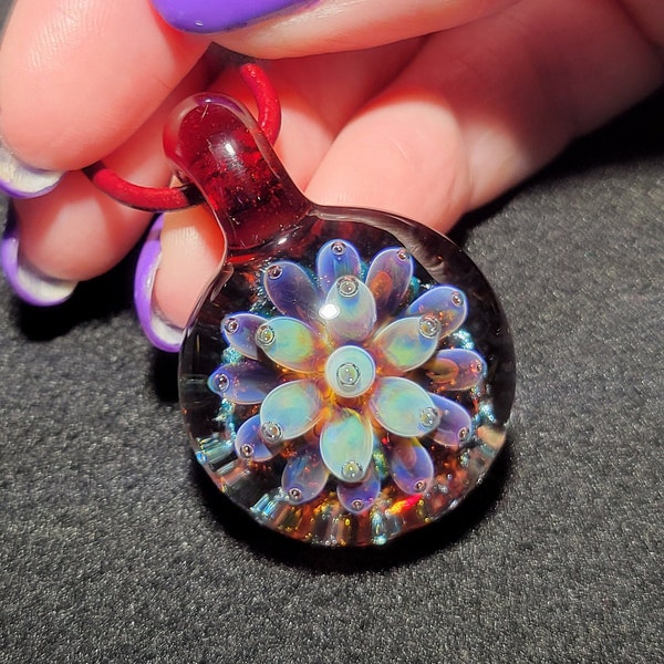 Handmade borosilicate glass choker pendant with a translucent lotus flower implosion on a round leather cord with sterling silver!