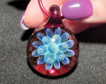 Boro Implosion pendant hand blown glass with a red base with green, & blues Implosion design in borosilicate glass!