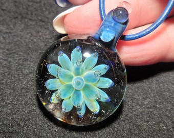 Color changing Implosion pendant, hand blown glass in mesmerizing borosilicate with UV reactive glow glass.