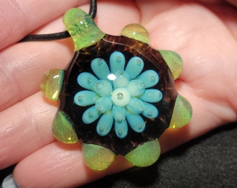 Boro Implosion pendant hand blown glass with a black base with turquoise Implosion design in borosilicate glass!
