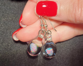 White Gilson opals encased in borosilicate glass earrings in sterling silver.  I call this teardrop dangle earring design “Mermaid’s tears”.