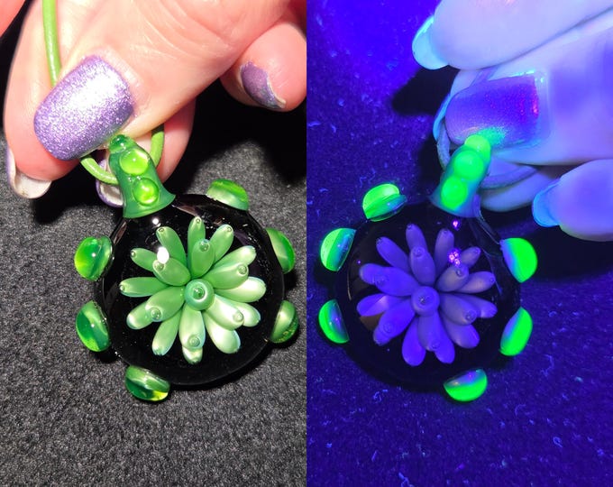 Heady Hand blown glass Jewelry.  Borosilicate pendant with UV reactive glow glass.  Color changing glass Implosion necklace for blacklights