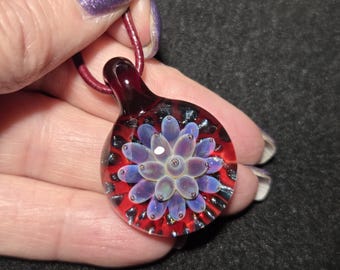 Borosilicate artisan glass choker, hand blown glass pendant with a ruby red, pink and purple implosion design.  Blown glass jewelry.