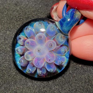 Hand blown glass implosion pendant, handmade borosilicate glass necklace, with purple flower.  Handcrafted glass jewelry