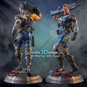 May include: A detailed 3D-printed figurine of a character in a blue and yellow costume, holding a large weapon. The figure has metallic armour and is standing on a base with debris. The website address "www.malix3design.com" is visible.