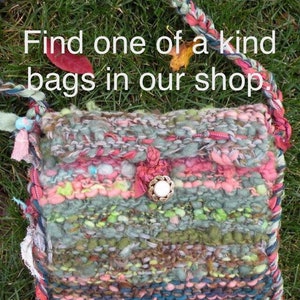 May include: A woven tapestry bag with a colorful striped pattern in shades of pink, green, blue, and brown. The bag has a braided strap and a decorative button.