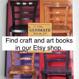 May include: A book titled "The Ultimate Book Of" with four chairs in the background. The chairs are painted in different colors and have a distressed look. The text "Find craft and art books in our Etsy shop." is at the bottom of the image.