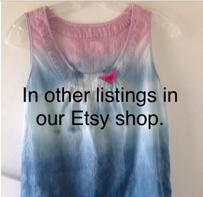 May include: A blue and pink tie-dye tank top with a small pink triangle sewn on the front. The text "In other listings in our Etsy shop." is printed on the front of the tank top.