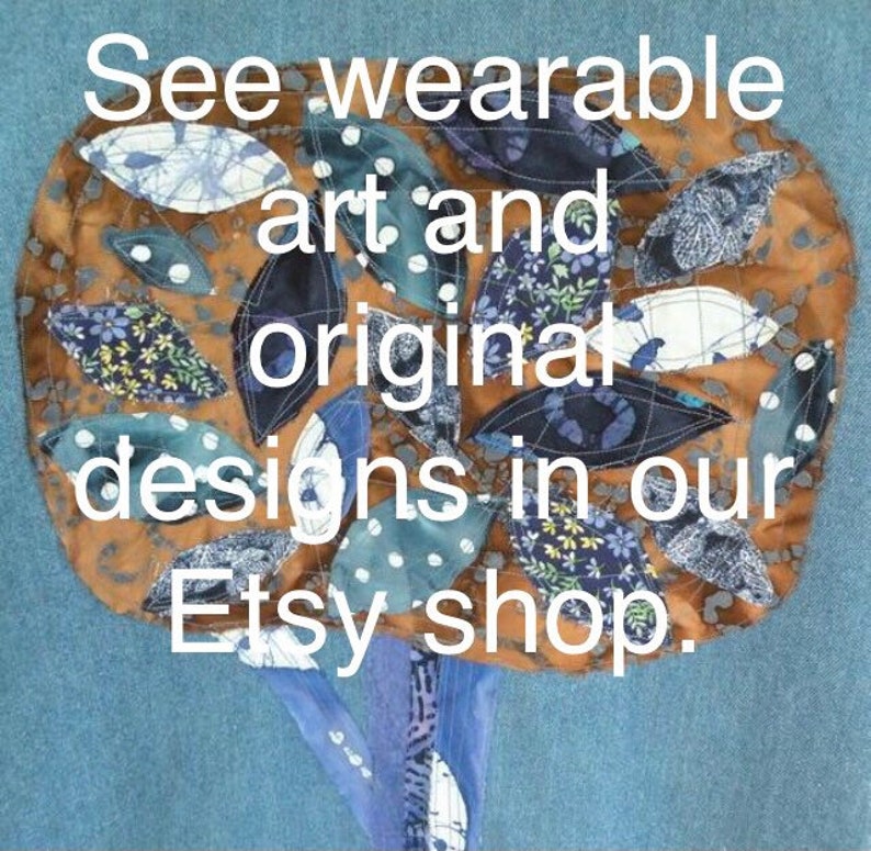 May include: A brown fabric tree with blue and white patterned leaves. The text "See wearable art and original designs in our Etsy shop." is written on the tree.