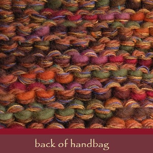 May include: Close-up of the back of a handbag made of woven fabric with a variety of colors, including brown, orange, red, green, and blue.