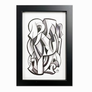 May include: Black framed abstract art print. The artwork features a black and white design with geometric shapes and lines. The print is signed and dated 2017. The frame is rectangular and has a simple, modern design.