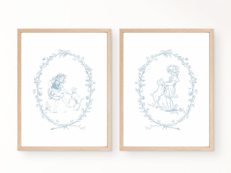 May include: Two framed prints with a blue and white illustration of a girl and a lamb in a wreath of flowers.