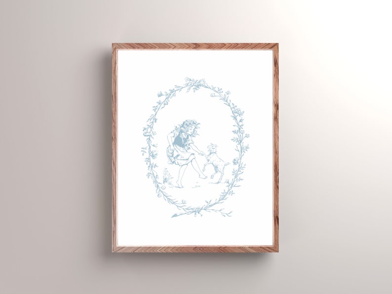 May include: A blue and white illustration of a girl and a dog in a wreath of flowers. The girl is wearing a dress and the dog is sitting on its hind legs. The illustration is framed in a light wood frame.
