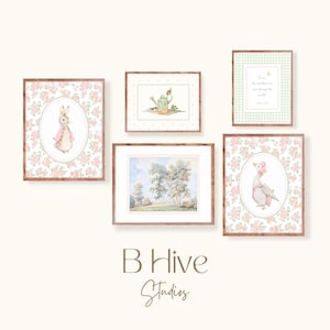 May include: A set of five framed prints featuring illustrations of a rabbit, a duck, a watering can, a bird, and a landscape. The frames are all brown wood with a white mat. The prints are all in a vintage style with a soft color palette.