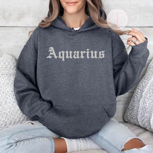 Aquarius Zodiac Hoodie: Embossed Horoscope Pullover