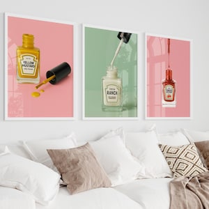Puede incluir: Tres impresiones enmarcadas de botellas de esmalte de uñas con líquidos y etiquetas de diferentes colores. Las etiquetas dicen "Yellow Mustard", "Fresh Ranch" y "Tomato Ketchup".