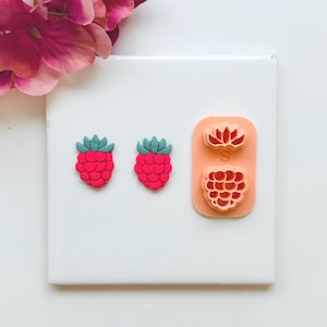 May include: A set of three ceramic mugs with a speckled, matte finish. The mugs are in shades of cream, light gray, and dark gray. Each mug has a simple, minimalist design, perfect for coffee or tea.