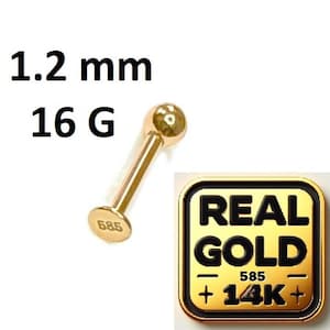 Peut inclure: Un piercing de couleur or de calibre 16 G, 1,2 mm avec une extrémité en forme de boule. Le clou est estampillé "585". Un carré doré avec les mots "REAL GOLD" et "14K+" est dans l'image.