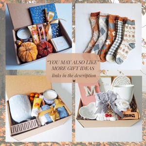 May include: Four gift boxes with various items, including candles, socks, and decorative pumpkins. One box contains a blue journal and a gold ribbon. The text in the image says "YOU MAY ALSO LIKE" and "MORE GIFT IDEAS links in the description".