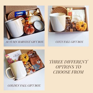 May include: Three gift box options are displayed, each with a fall theme. The boxes contain mugs, candles, and other seasonal items. Text on the image reads "Autumn Harvest Gift Box", "Cozy Fall Gift Box", and "Golden Fall Gift Box". The text also reads "Three Different Options to Choose From".