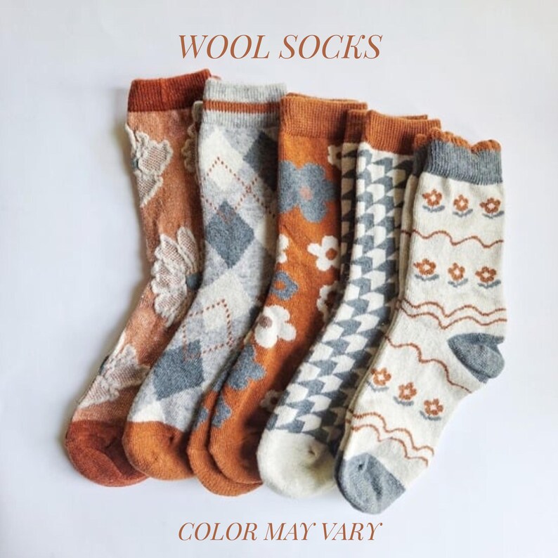 May include: A collection of wool socks in various patterns and colors. The socks feature designs such as floral, argyle, and geometric shapes. The color palette includes shades of orange, gray, and white. The text "WOOL SOCKS" and "COLOR MAY VARY" are displayed.