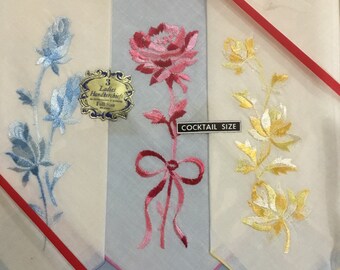 Three ladies handkerchiefs cocktail napkins, Never used in orgial box, Set of three, blue, pink yellow roses