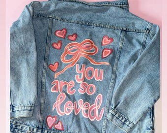 Hand Painted Denim Jacket – “You Are So Loved” – Custom Pink Bow & Hearts – Inspirational Statement Jacket – Gift for Her