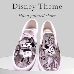May include: Pair of white slip-on shoes with hand-painted Disney theme artwork. One shoe features Mickey Mouse driving a vehicle, the other shows Mickey as the Sorcerer's Apprentice. The text "Disney Theme" and "Hand painted shoes" is visible.