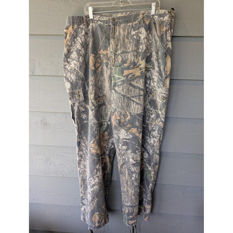 Pantaloni vintage Mossy Oak da uomo, taglia 42x32, in tela mimetica, vestibilità comoda, ideali per la caccia, stile anni '90. immagine 1
